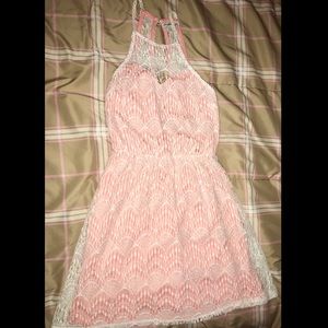 Lacy white dress with a pink  undergarment